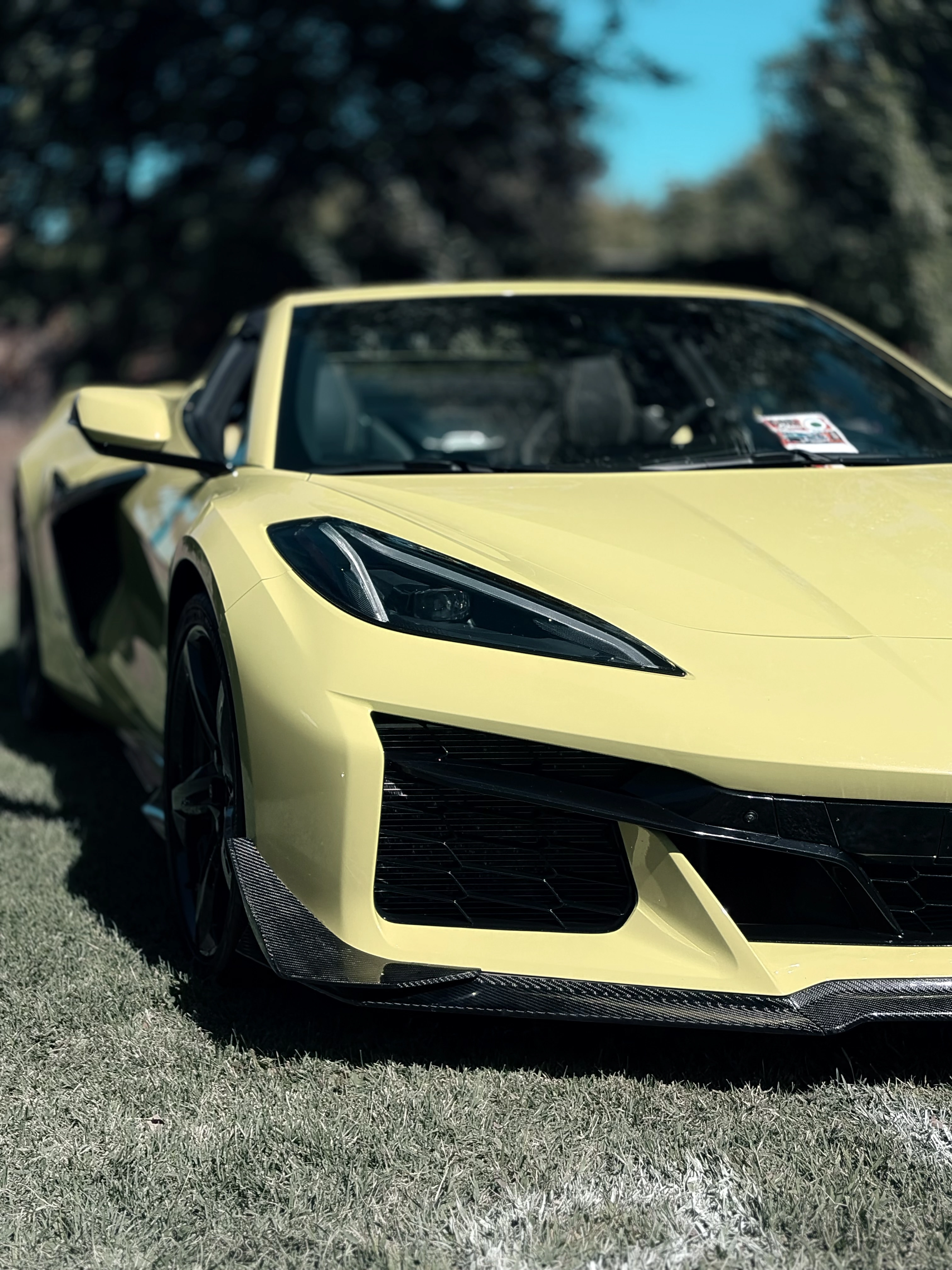 Yellow Corvette sports car in afternoon sunlight