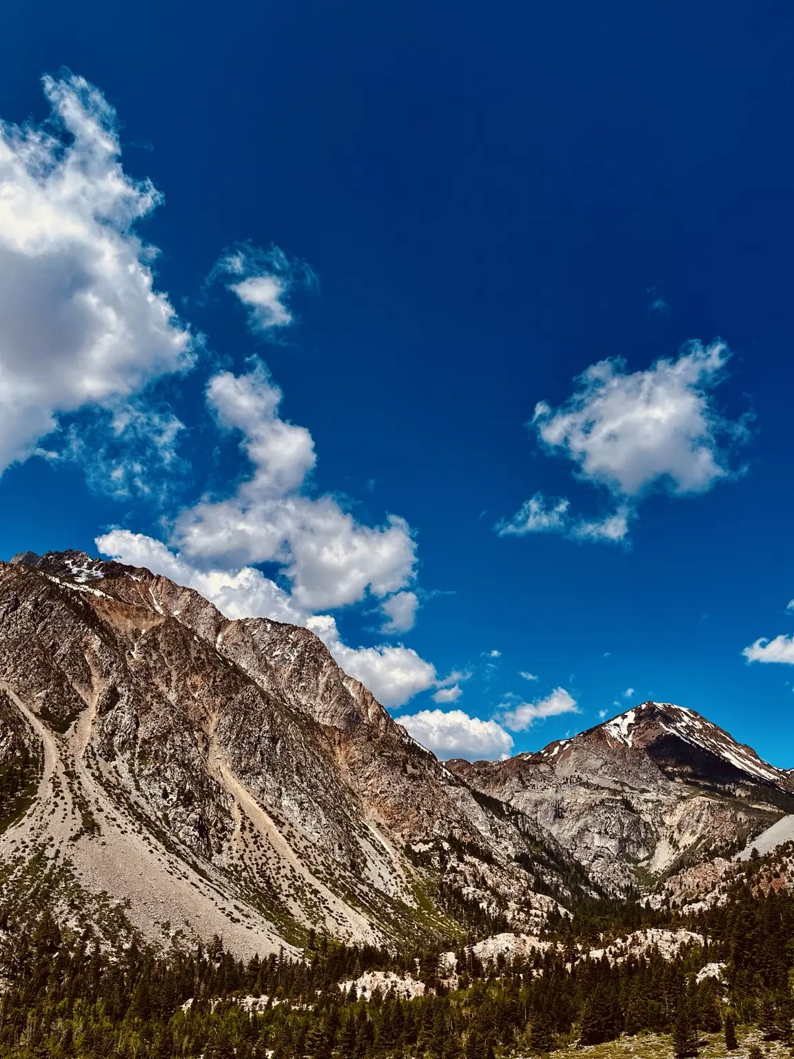 Sierra granite beneath fast-moving clouds