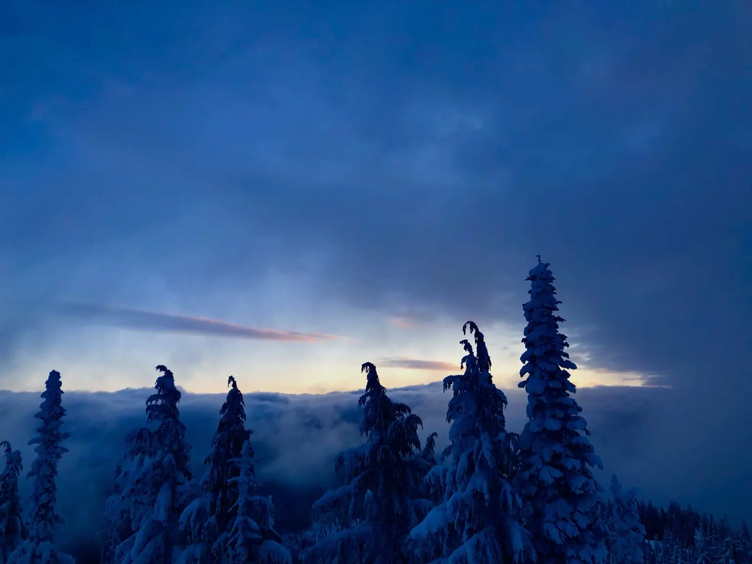 Golden sunset over a snow-covered mountain valley